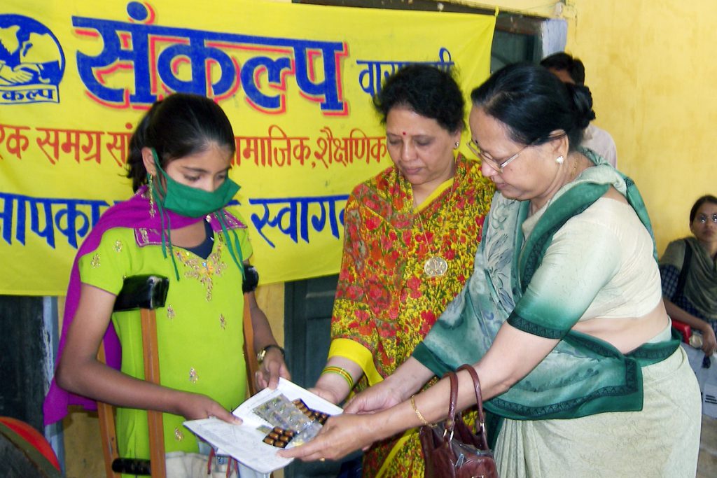 Medicine distribution By  President of "Mahila Mandal"