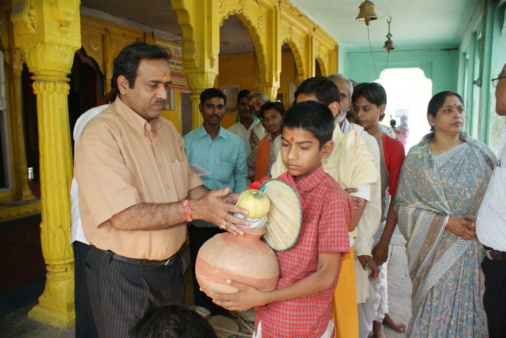 Donating Ghat,Fruit and Muddra to Bhramin On account of Akchay Tritiya.