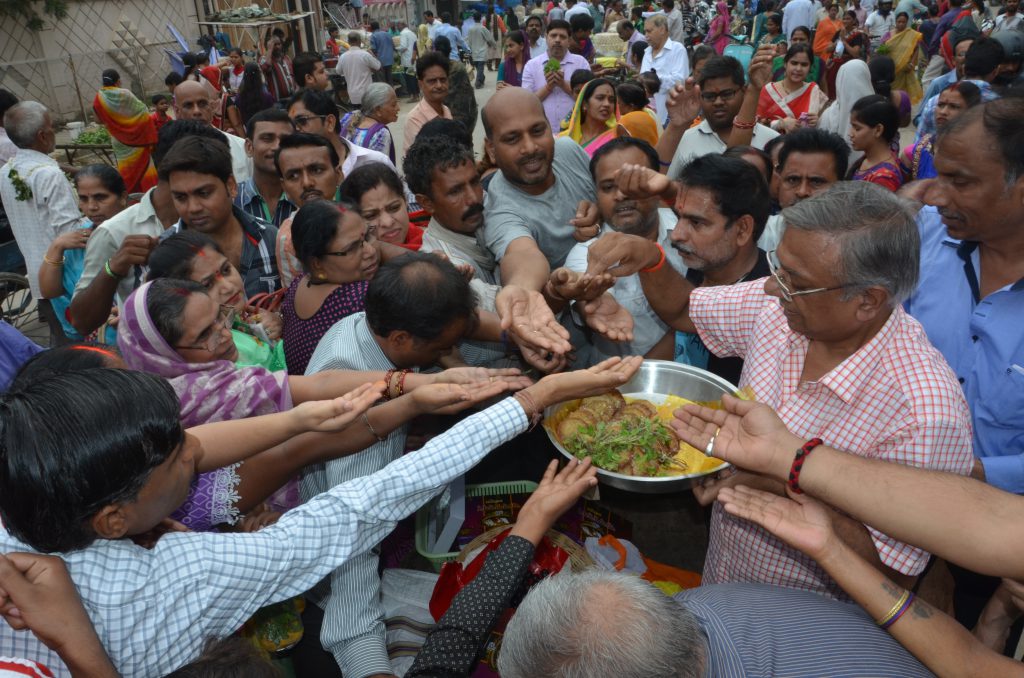 Distribution of Prasad in Ratyatra Mela by Mr. A. K Jain (Parton Sankalp).