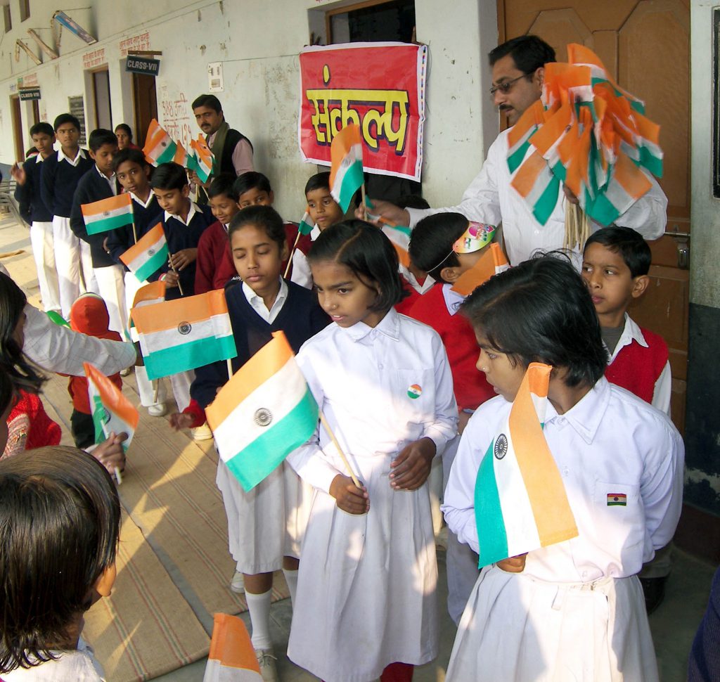 Distribution of cloth bag instead of plastic flag on occasion  of Republic Day among the children of schools.