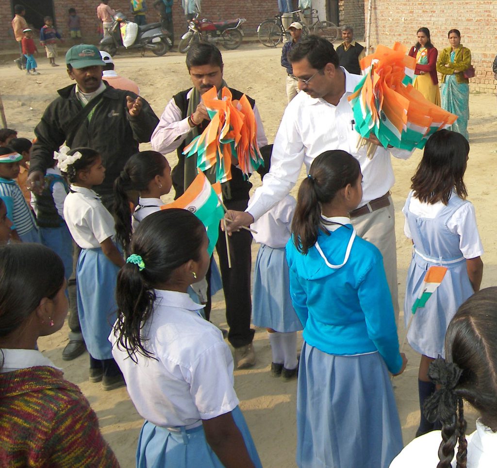 Distribution of cloth bag instead of plastic flag on occasion  of Republic Day among the children of schools.