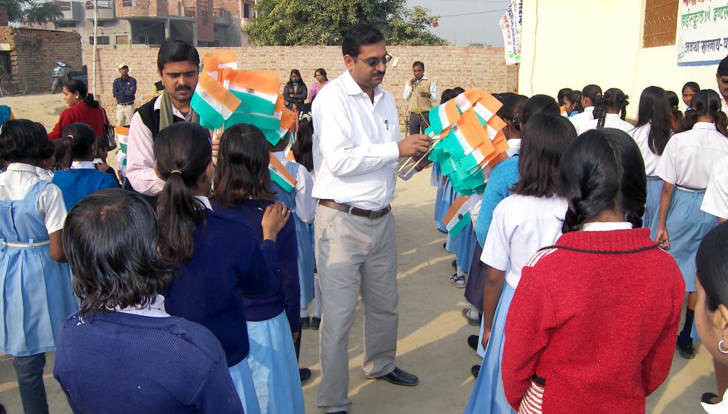 Distribution of cloth bag instead of plastic flag on occasion  of Republic Day among the children of schools.