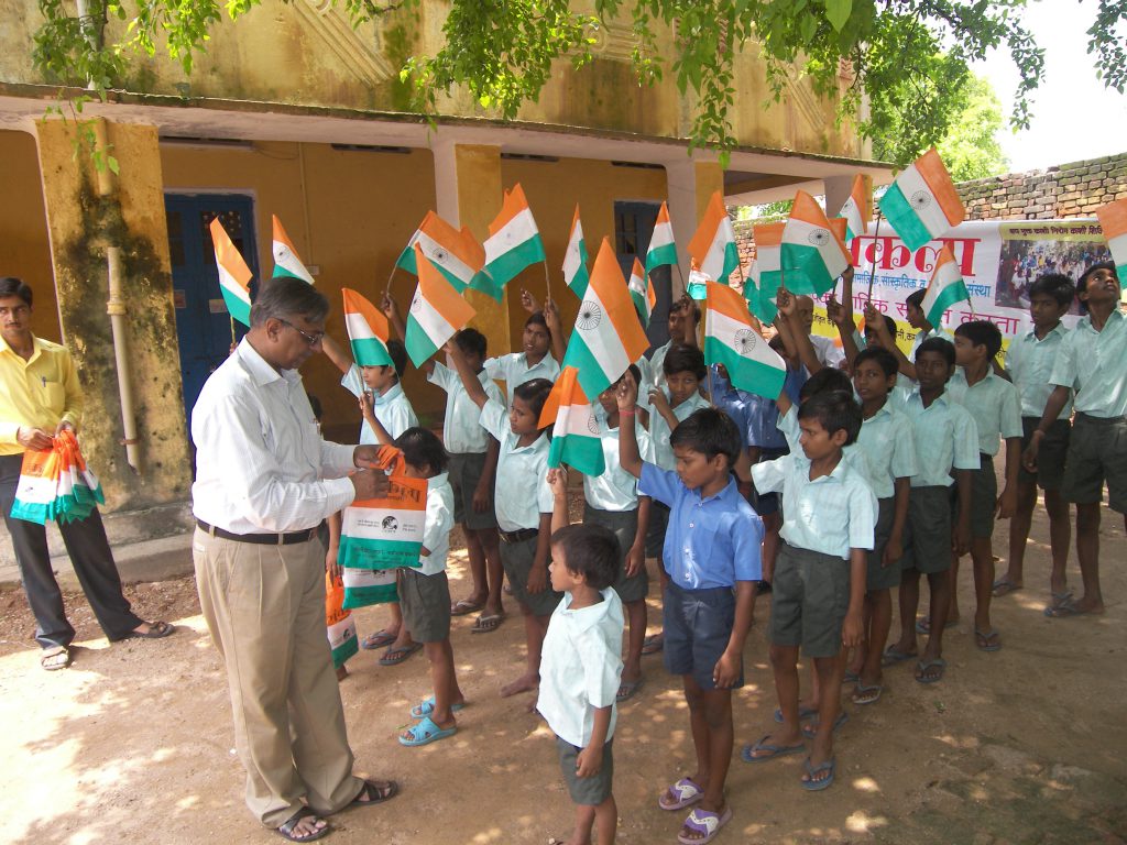 Distribution of cloth bag instead of plastic flag on occasion  of Republic Day among the children of schools.