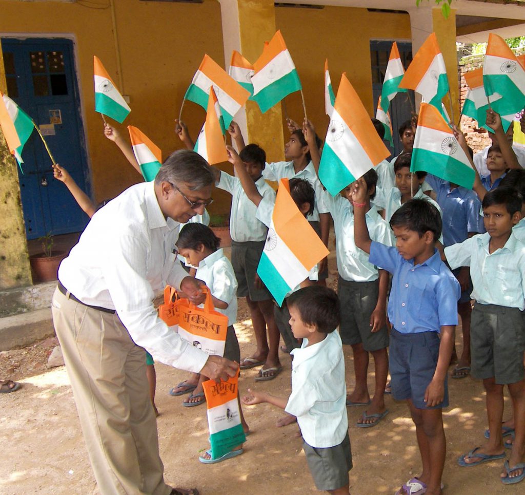 Distribution of cloth bag instead of plastic flag on occasion  of Republic Day among the children of schools.