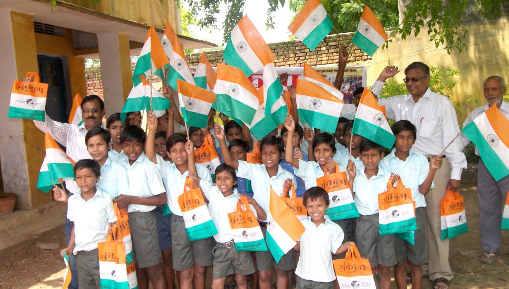 Distribution of cloth bag instead of plastic flag on occasion  of Republic Day among the children of schools.