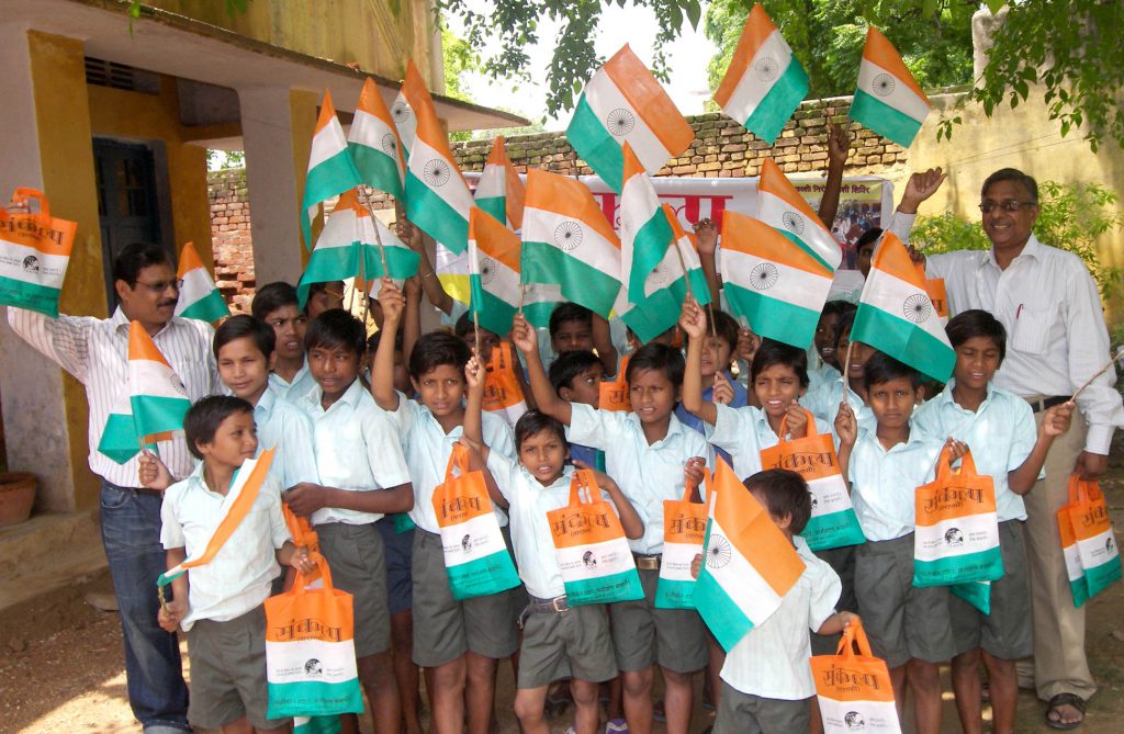 Distribution of cloth bag instead of plastic flag on occasion  of Republic Day among the children of schools.