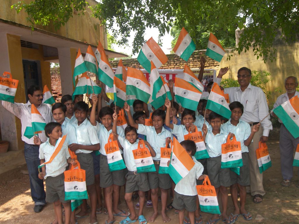 Distribution of cloth bag instead of plastic flag on occasion  of Republic Day among the children of schools.